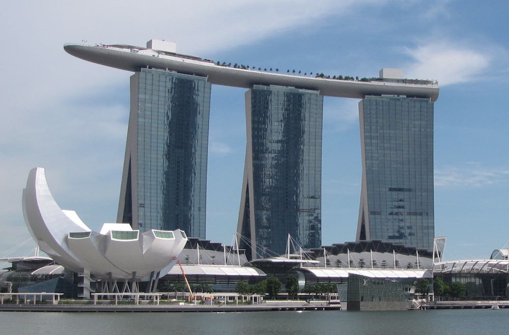 photo of the Marina Bay Sands resort that resembles 3 sky-scapers connected on top by a large ship